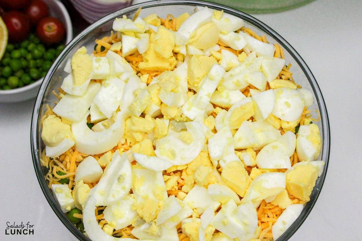 7 Layer Salad Recipe 26 - This Classic 7 Layer Salad is a tasty, healthy and fun make ahead salad for gatherings. It brings a burst of flavor and color to your table, making it a perfect choice for any relaxed get-together or potluck. Enjoy creating and sharing this delightful layered salad!