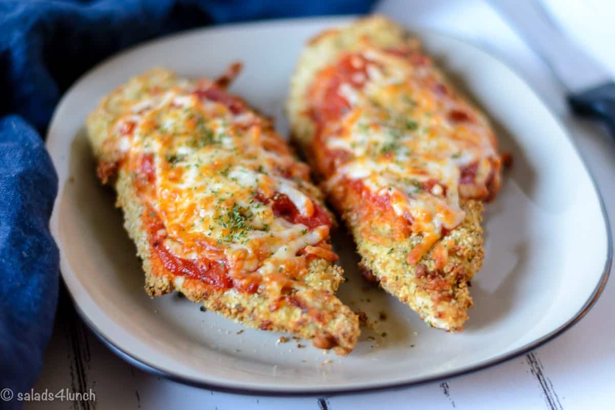 Air Fryer Chicken Parmesan 11 - Making this air fryer chicken parmesan is easy to do and takes half the time than it does in the conventional oven. Crispy and delicious! Garnish with parsley, serve with Easy Air Fryer Broccoli and enjoy!!