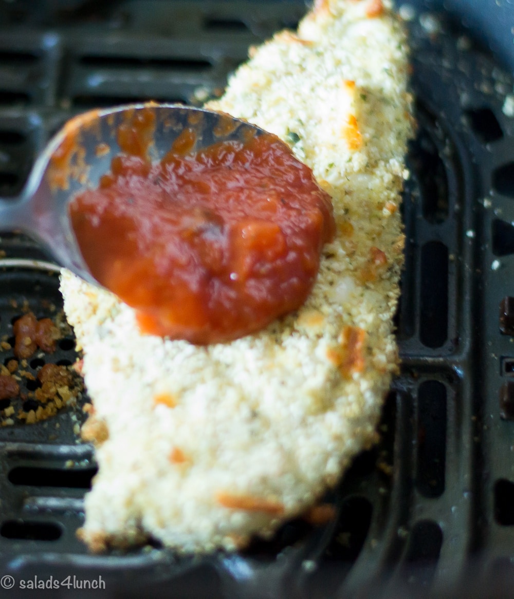 Air Fryer Chicken Parmesan 7 - Making this air fryer chicken parmesan is easy to do and takes half the time than it does in the conventional oven. Crispy and delicious! Garnish with parsley, serve with Easy Air Fryer Broccoli and enjoy!!