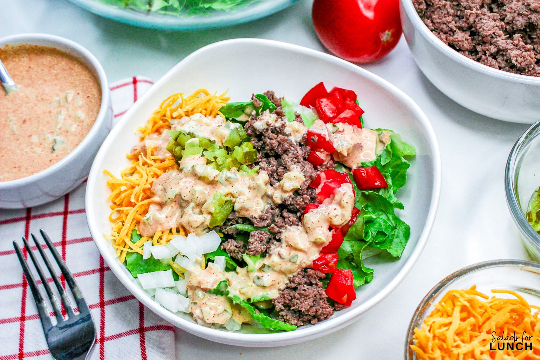38 Healthy Salads for Lunch Recipes - Big Mac Salad Bowl Recipe 13 Big Mac Salad Bowl Recipe 13 - Shake up your weekday lunch with these tasty, healthy salads for lunch recipes that are great on the go. Make a filling and healthy salad that will power you through any work day. Full of protein and fiber these quick salads are an easy way to spruce up your lunch.