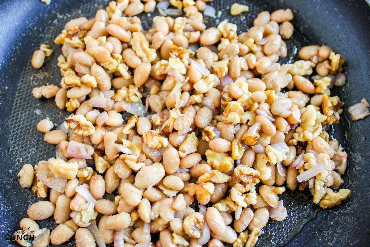 Butterbean and Walnut Kale Salad with Maple Tahini Dressing Recipe 4 - A warm and hearty vegan and gluten-free kale salad featuring quinoa, sautéed butter beans, shallots, and walnuts, all topped with a luscious maple tahini dressing.