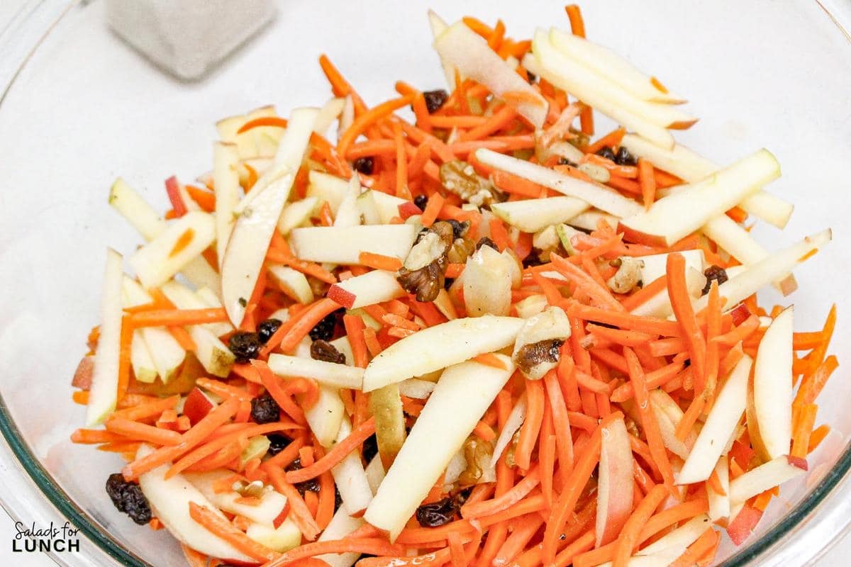 Carrot Raisin Salad with Apples Recipe 10 - This fresh and simple carrot raisin salad combines crisp apples and crunchy carrots with a light, tangy dressing. It's a perfect vegetarian side dish for a light lunch or dinner, bringing together sweetness and a bit of zest.