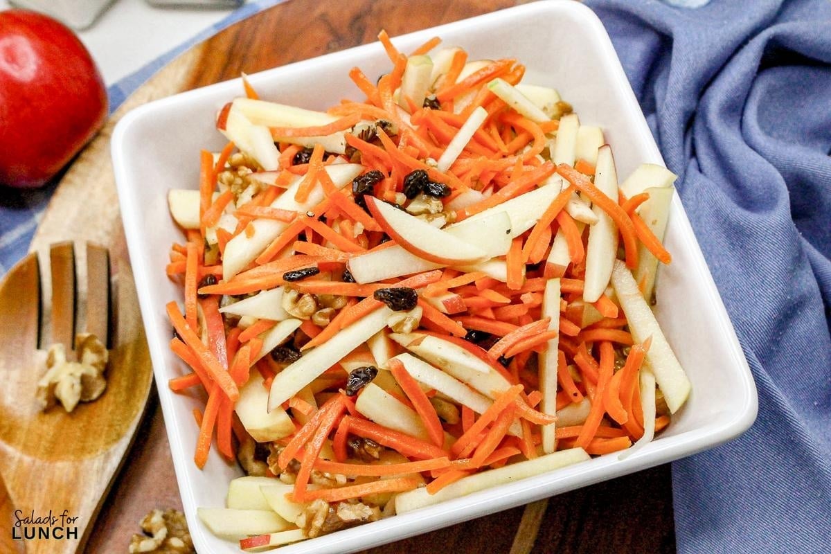 Carrot Raisin Salad with Apples Recipe 11 - This fresh and simple carrot raisin salad combines crisp apples and crunchy carrots with a light, tangy dressing. It's a perfect vegetarian side dish for a light lunch or dinner, bringing together sweetness and a bit of zest.