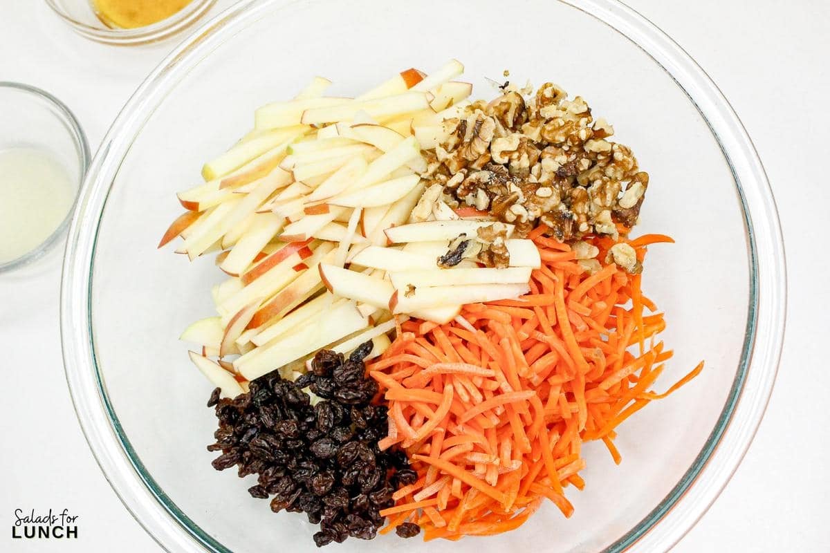 Carrot Raisin Salad with Apples Recipe 4 - This fresh and simple carrot raisin salad combines crisp apples and crunchy carrots with a light, tangy dressing. It's a perfect vegetarian side dish for a light lunch or dinner, bringing together sweetness and a bit of zest.