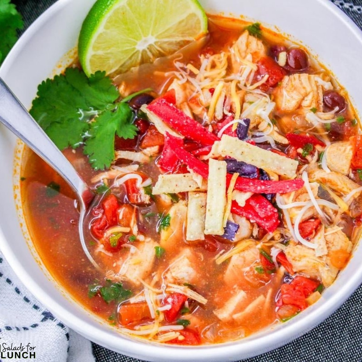 Chilis Copycat Southwest Chicken Soup Recipe 1 - Indulge in a taste fiesta with this Chili's Copycat Southwest Chicken Soup! Hearty, flavorful, and easy to make, this soul-warming delight features tender chicken, black beans, and hominy in a smoky chipotle broth. Spice it up and savor the Southwest in every comforting spoonful.