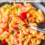 Delicious creamy shrimp pasta salad served on a stylish grey plate.