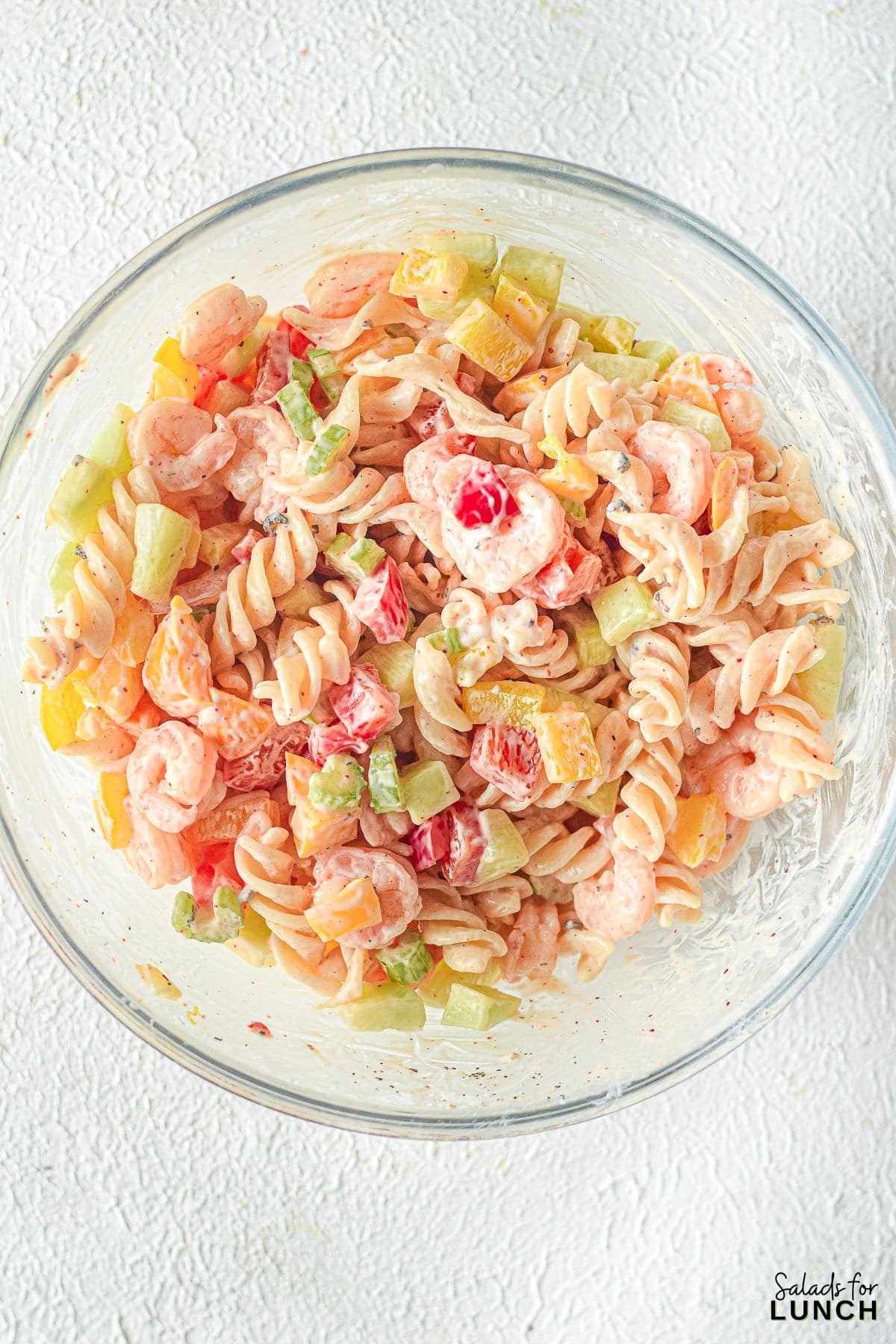 Creamy Shrimp Pasta Salad 10 - Indulge in the ultimate summer delight with our Creamy Shrimp Pasta Salad Recipe and let the flavors transport you to a sunny beachside retreat. Whether you're seeking a satisfying meal or a crowd-pleasing dish, this recipe is sure to become a staple in your culinary repertoire. So, grab your apron and get ready to embark on a culinary journey that will leave your taste buds dancing with joy!