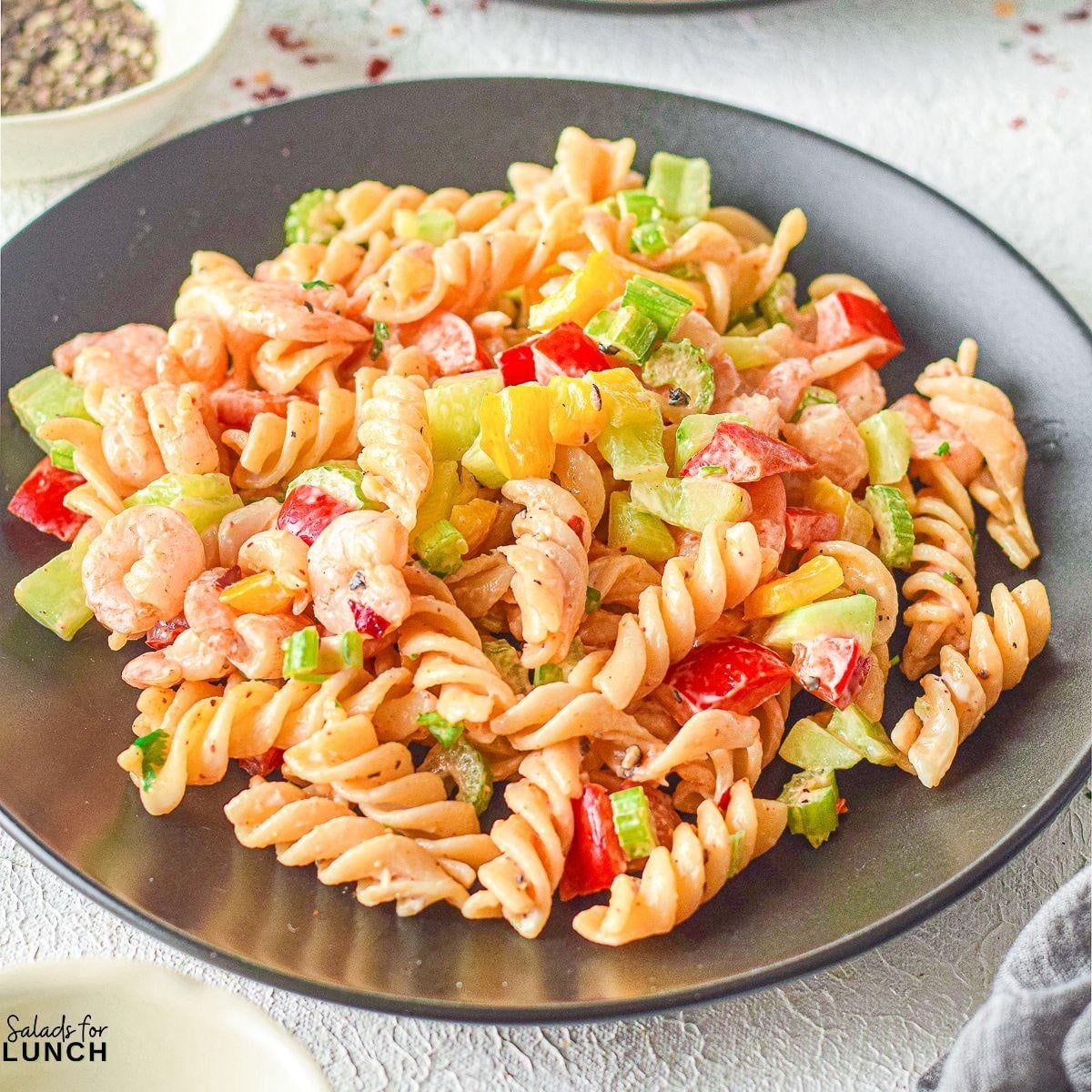 Creamy Shrimp Pasta Salad 2 - Indulge in the ultimate summer delight with our Creamy Shrimp Pasta Salad Recipe and let the flavors transport you to a sunny beachside retreat. Whether you're seeking a satisfying meal or a crowd-pleasing dish, this recipe is sure to become a staple in your culinary repertoire. So, grab your apron and get ready to embark on a culinary journey that will leave your taste buds dancing with joy!