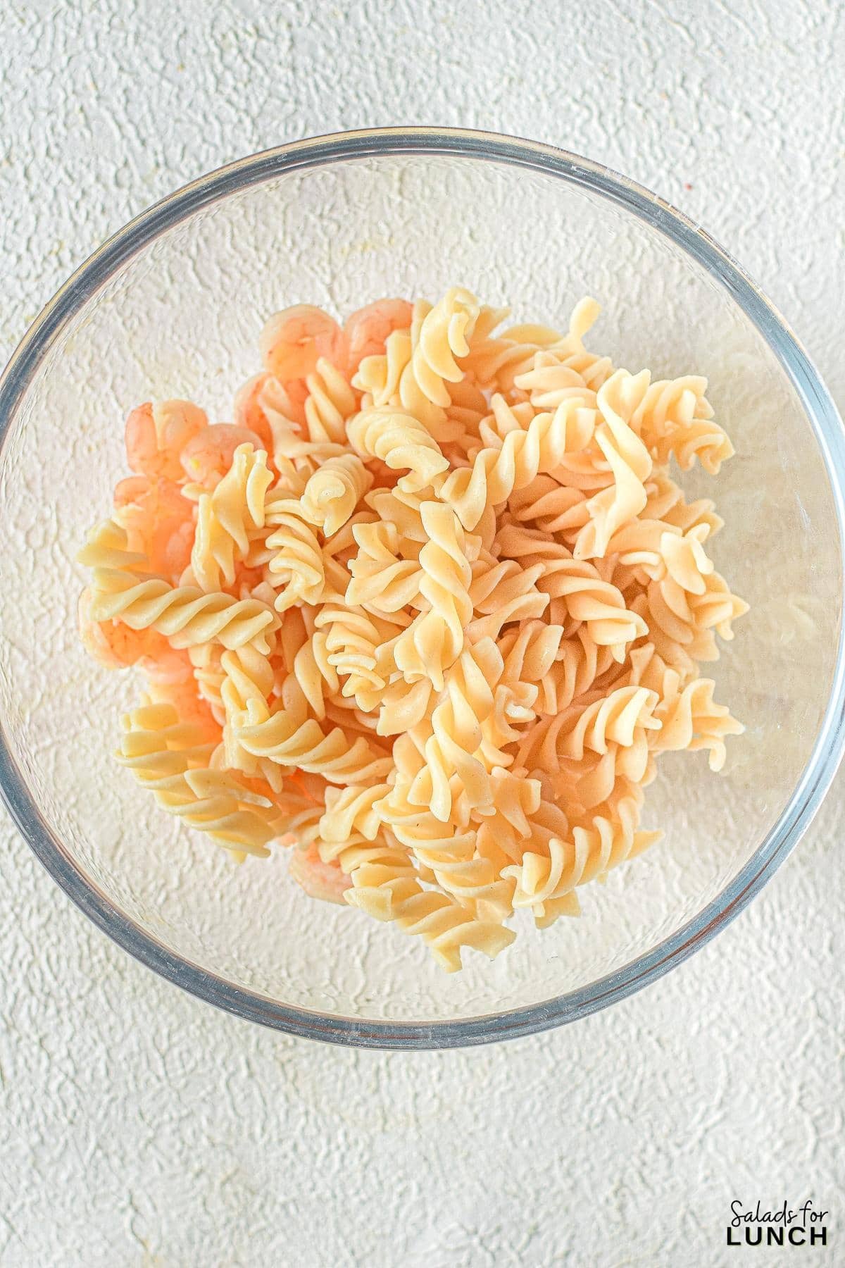 Creamy Shrimp Pasta Salad 5 - Indulge in the ultimate summer delight with our Creamy Shrimp Pasta Salad Recipe and let the flavors transport you to a sunny beachside retreat. Whether you're seeking a satisfying meal or a crowd-pleasing dish, this recipe is sure to become a staple in your culinary repertoire. So, grab your apron and get ready to embark on a culinary journey that will leave your taste buds dancing with joy!