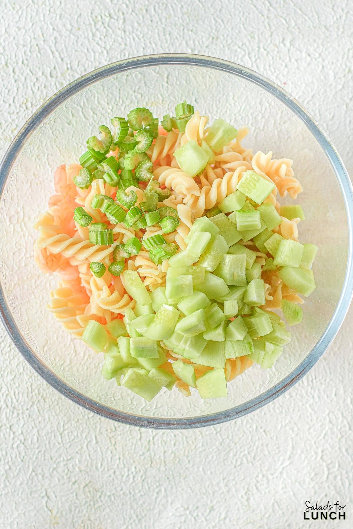 Creamy Shrimp Pasta Salad 6 - Indulge in the ultimate summer delight with our Creamy Shrimp Pasta Salad Recipe and let the flavors transport you to a sunny beachside retreat. Whether you're seeking a satisfying meal or a crowd-pleasing dish, this recipe is sure to become a staple in your culinary repertoire. So, grab your apron and get ready to embark on a culinary journey that will leave your taste buds dancing with joy!