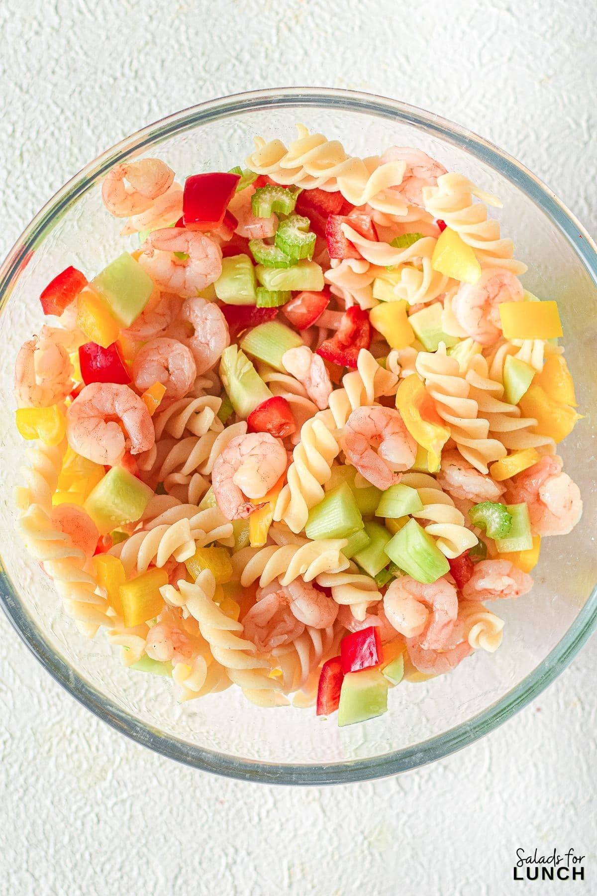 Creamy Shrimp Pasta Salad 8 - Indulge in the ultimate summer delight with our Creamy Shrimp Pasta Salad Recipe and let the flavors transport you to a sunny beachside retreat. Whether you're seeking a satisfying meal or a crowd-pleasing dish, this recipe is sure to become a staple in your culinary repertoire. So, grab your apron and get ready to embark on a culinary journey that will leave your taste buds dancing with joy!