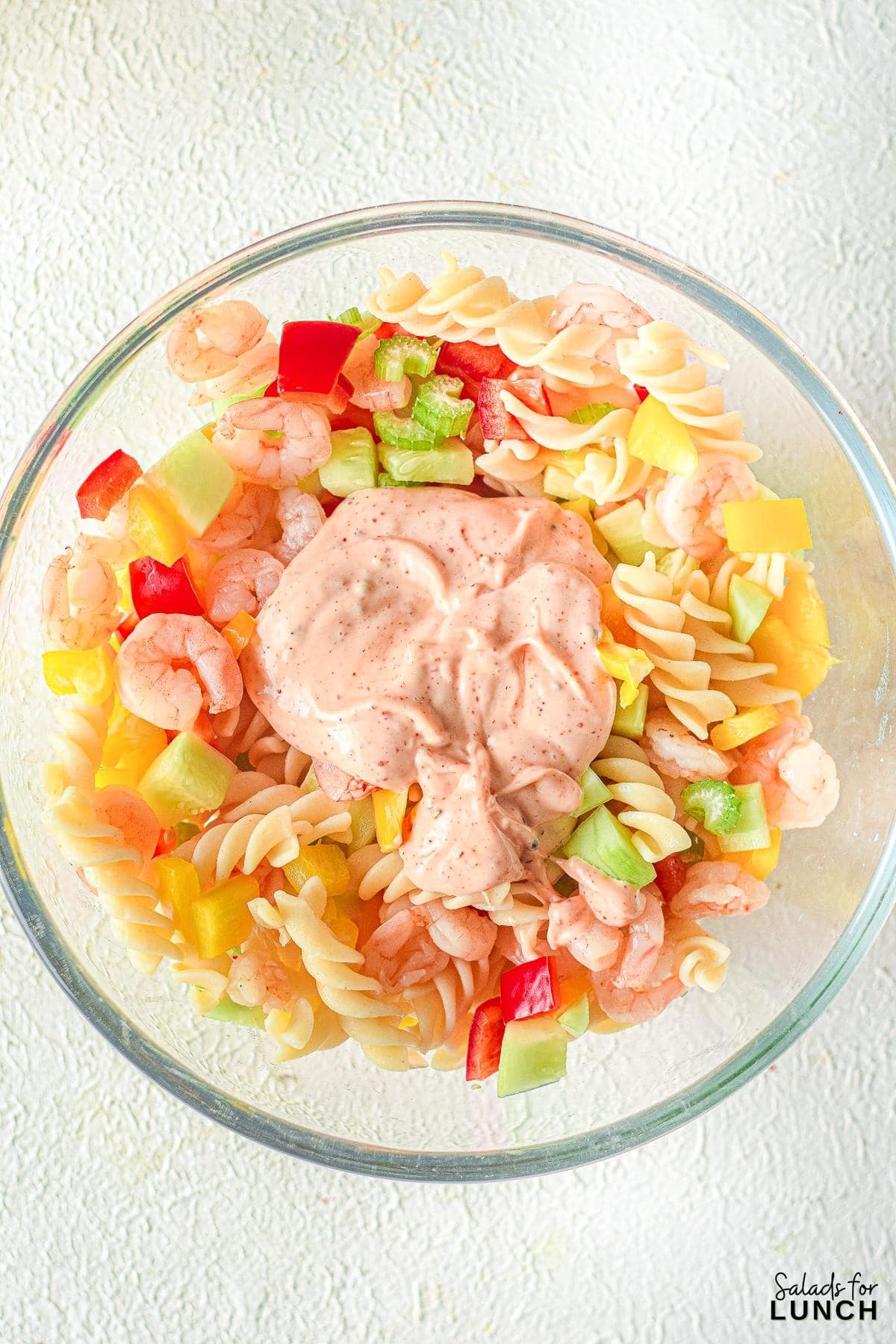 Creamy Shrimp Pasta Salad 9 - Indulge in the ultimate summer delight with our Creamy Shrimp Pasta Salad Recipe and let the flavors transport you to a sunny beachside retreat. Whether you're seeking a satisfying meal or a crowd-pleasing dish, this recipe is sure to become a staple in your culinary repertoire. So, grab your apron and get ready to embark on a culinary journey that will leave your taste buds dancing with joy!