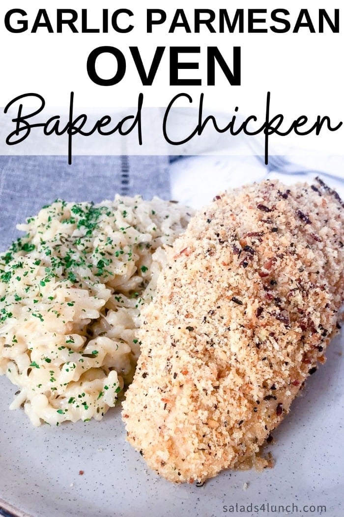 Close up of garlic parmesan baked chicken breast with a side of risotto on a white plate on a grey napkin with text overlay that says "Garlic Parmesan Oven Baked Chicken".