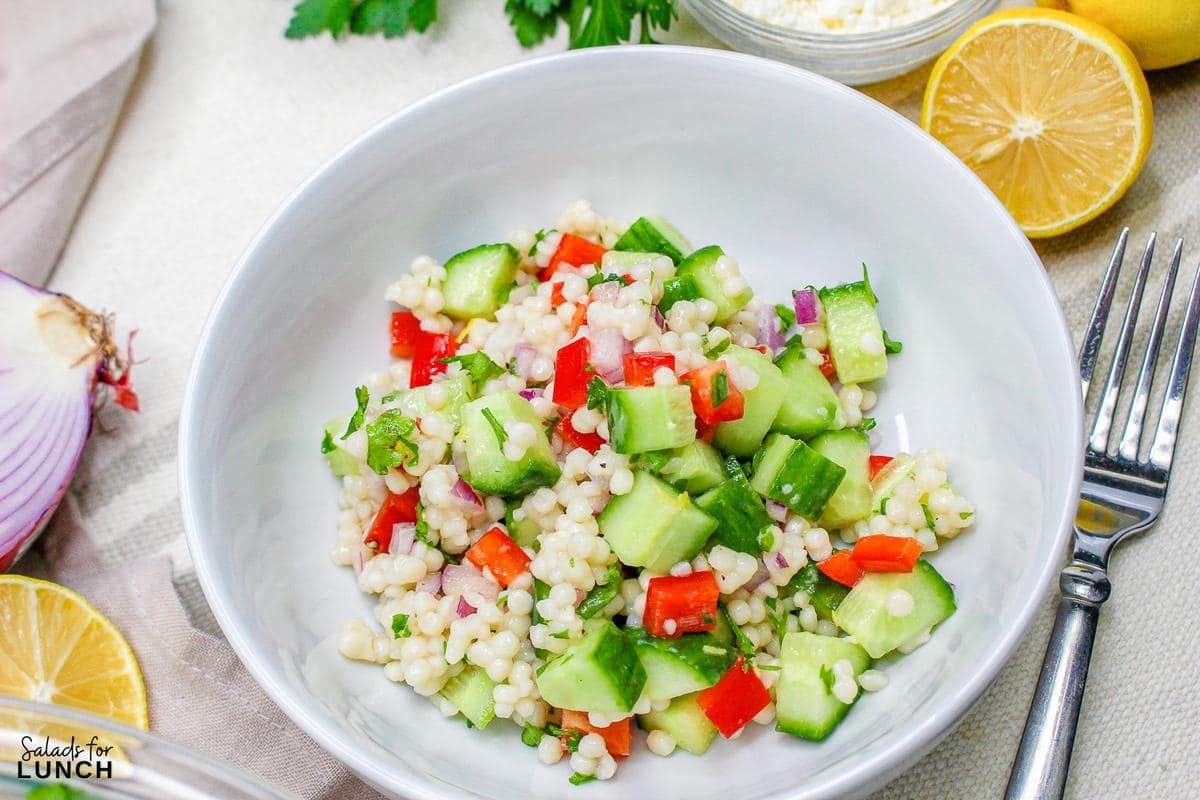 Easy Lemon Couscous Salad Recipe 13 - Zesty Lemon Couscous Salad - a refreshing and vibrant summer salad recipe bursting with citrusy flavors, feta cheese and crisp veggies!