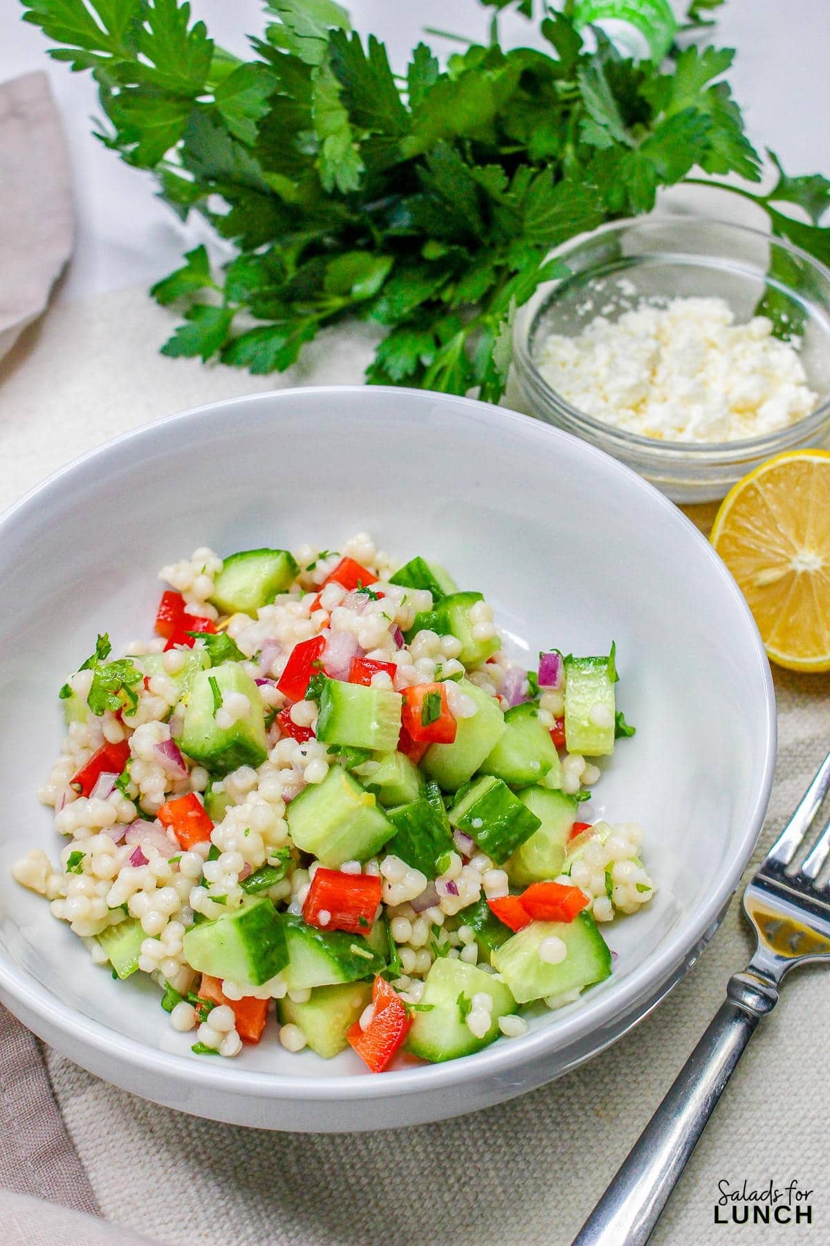 Easy Lemon Couscous Salad Recipe 15 - Zesty Lemon Couscous Salad - a refreshing and vibrant summer salad recipe bursting with citrusy flavors, feta cheese and crisp veggies!