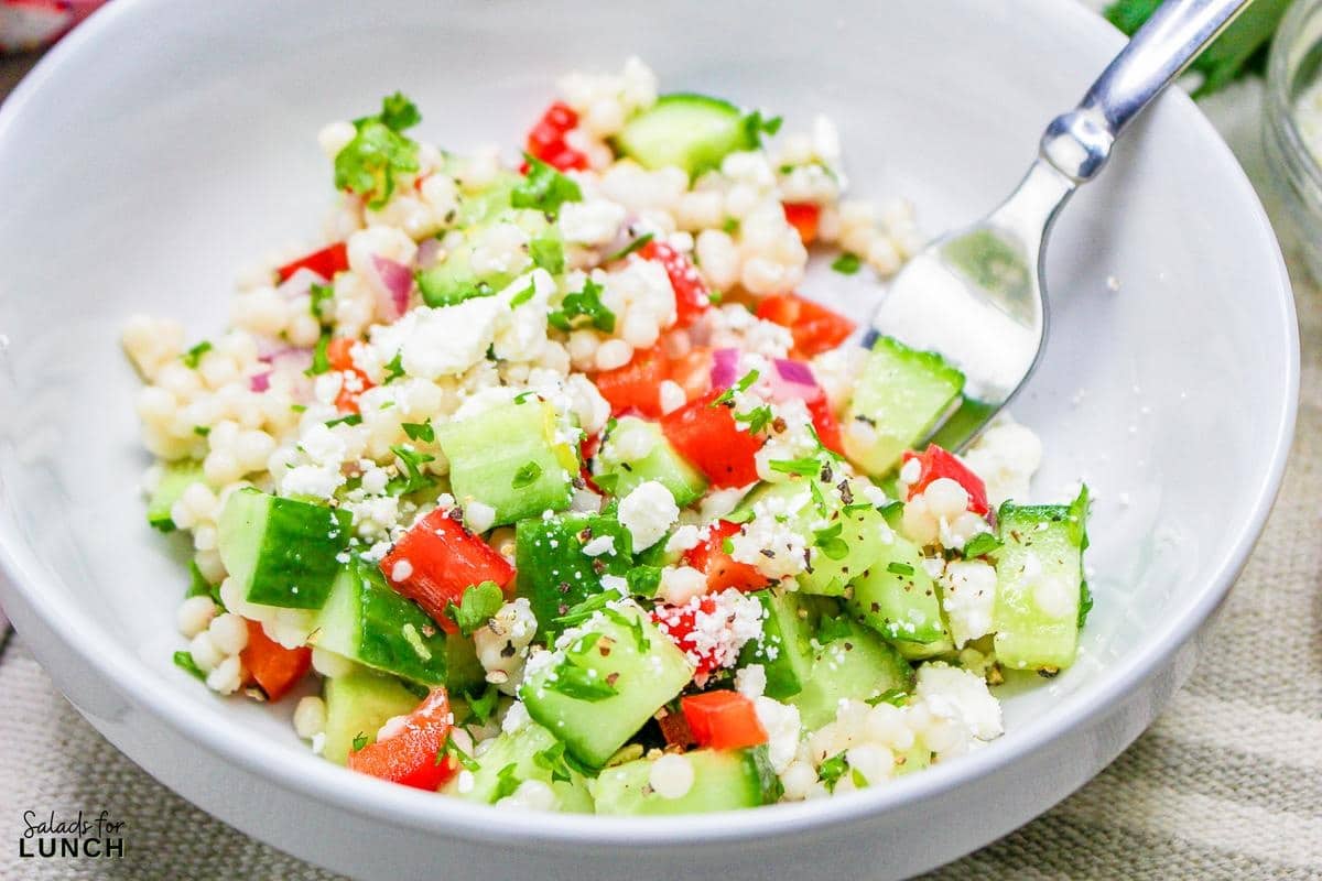 Easy Lemon Couscous Salad Recipe 23 - Zesty Lemon Couscous Salad - a refreshing and vibrant summer salad recipe bursting with citrusy flavors, feta cheese and crisp veggies!