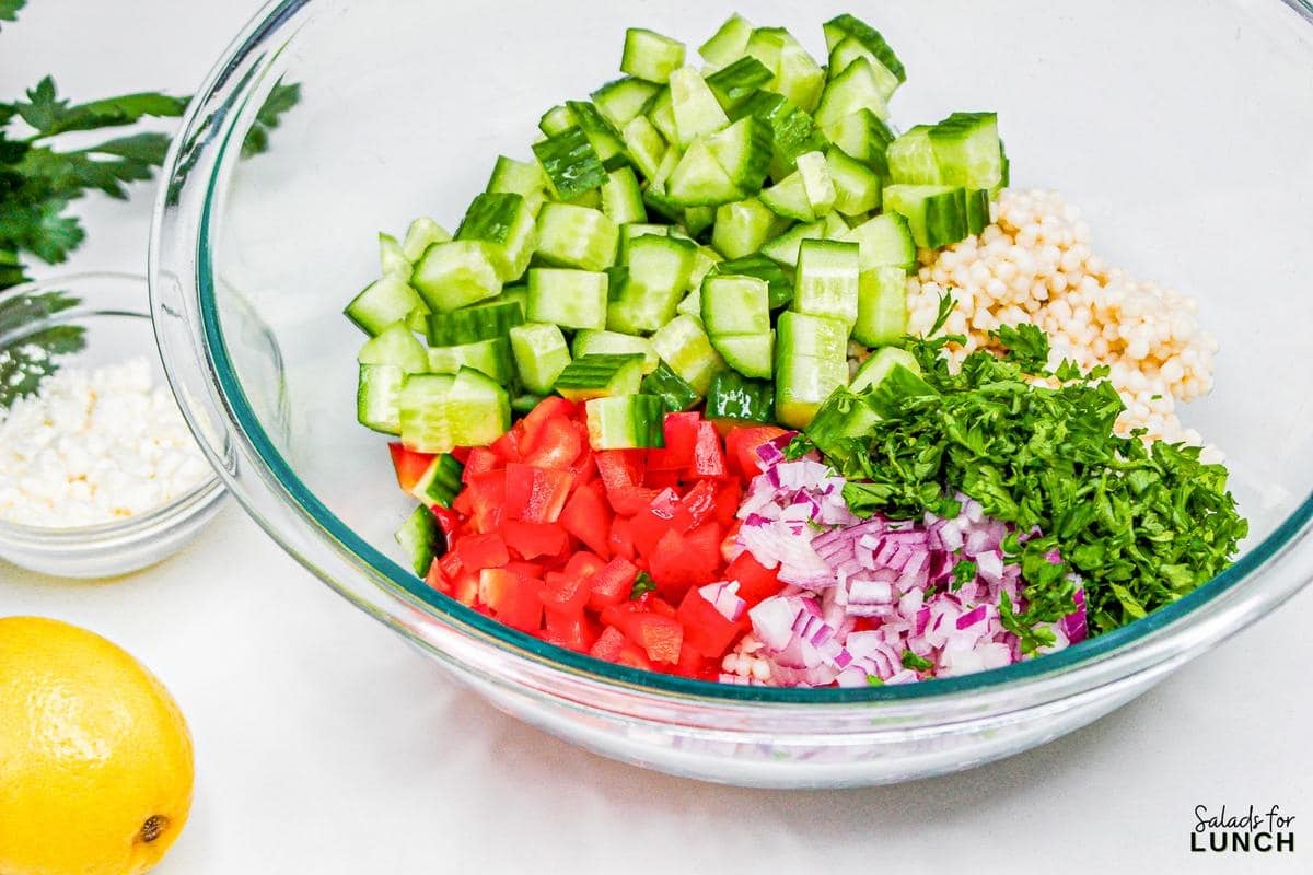 Easy Lemon Couscous Salad Recipe 3 - Zesty Lemon Couscous Salad - a refreshing and vibrant summer salad recipe bursting with citrusy flavors, feta cheese and crisp veggies!