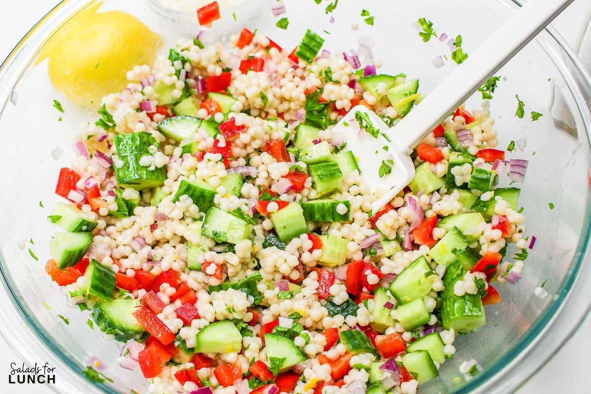 Easy Lemon Couscous Salad Recipe 9 - Zesty Lemon Couscous Salad - a refreshing and vibrant summer salad recipe bursting with citrusy flavors, feta cheese and crisp veggies!