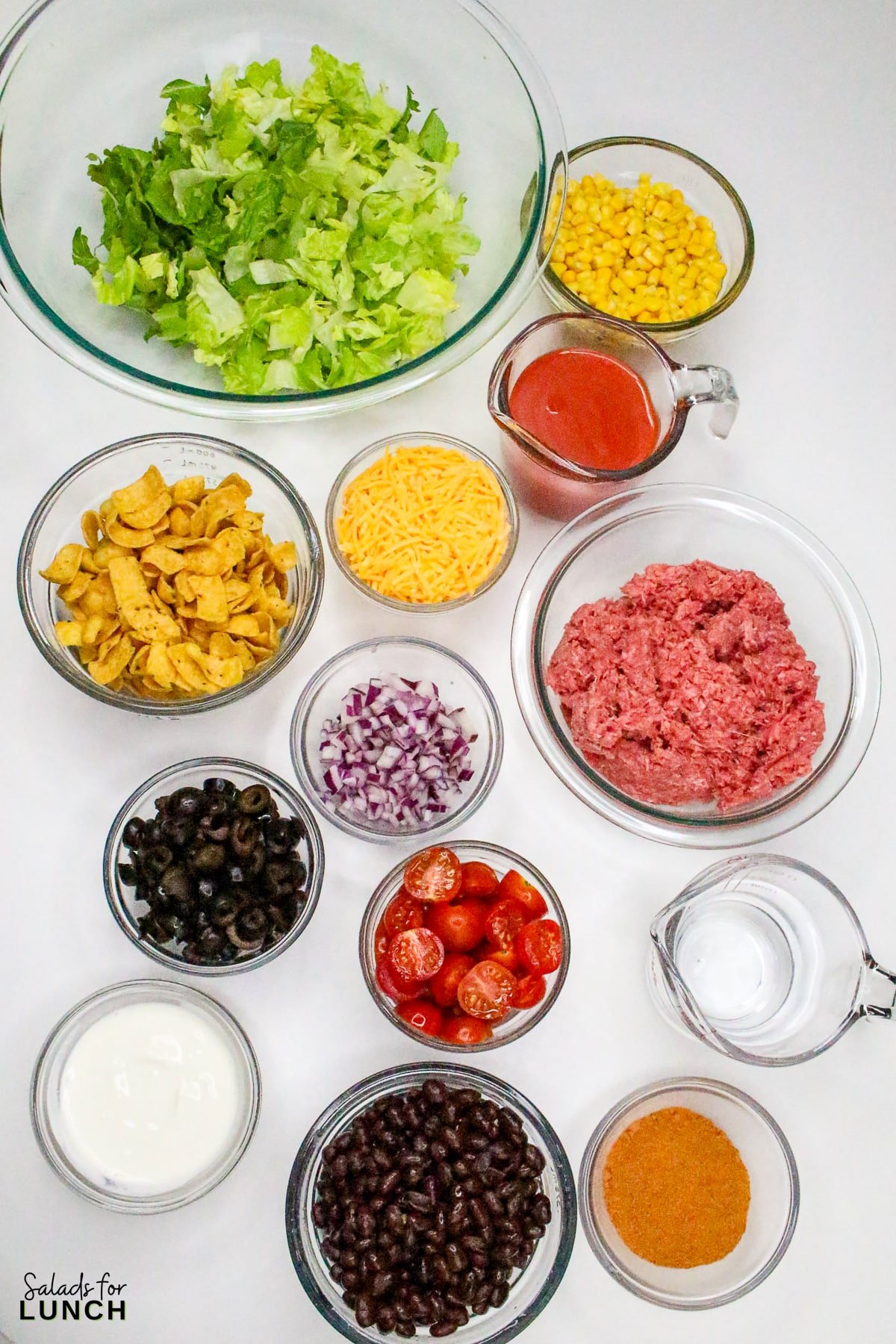 Frito Taco Salad Recipe 1 - Frito Taco Salad is a fun, flavorful, and easy dish that always gets rave reviews. Whether you're bringing it to a backyard BBQ, potluck, or just making it for a weeknight meal, it’s a guaranteed favorite. The combination of fresh ingredients, bold taco seasoning, and crispy Fritos makes every bite delicious. Give this recipe a try and watch it disappear in no time!