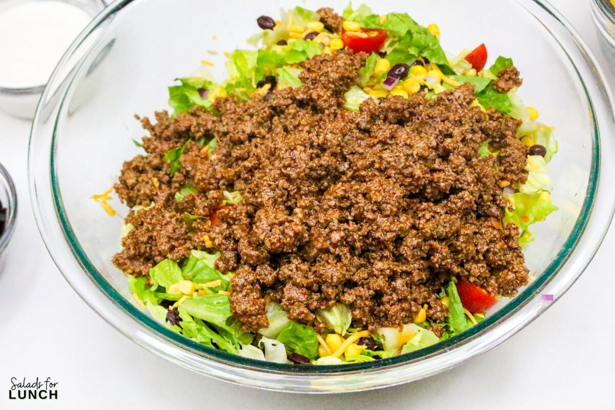 Frito Taco Salad Recipe 11 - Frito Taco Salad is a fun, flavorful, and easy dish that always gets rave reviews. Whether you're bringing it to a backyard BBQ, potluck, or just making it for a weeknight meal, it’s a guaranteed favorite. The combination of fresh ingredients, bold taco seasoning, and crispy Fritos makes every bite delicious. Give this recipe a try and watch it disappear in no time!