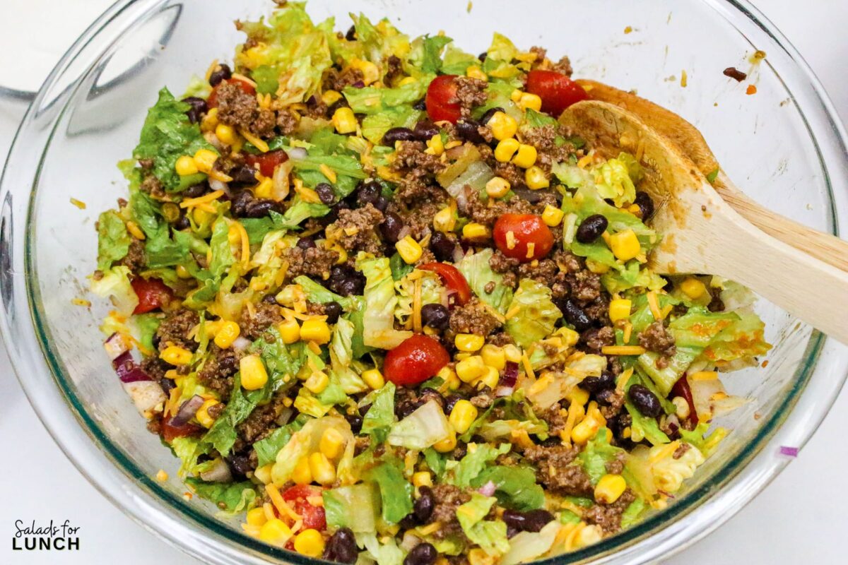Frito Taco Salad Recipe 13 - Frito Taco Salad is a fun, flavorful, and easy dish that always gets rave reviews. Whether you're bringing it to a backyard BBQ, potluck, or just making it for a weeknight meal, it’s a guaranteed favorite. The combination of fresh ingredients, bold taco seasoning, and crispy Fritos makes every bite delicious. Give this recipe a try and watch it disappear in no time!
