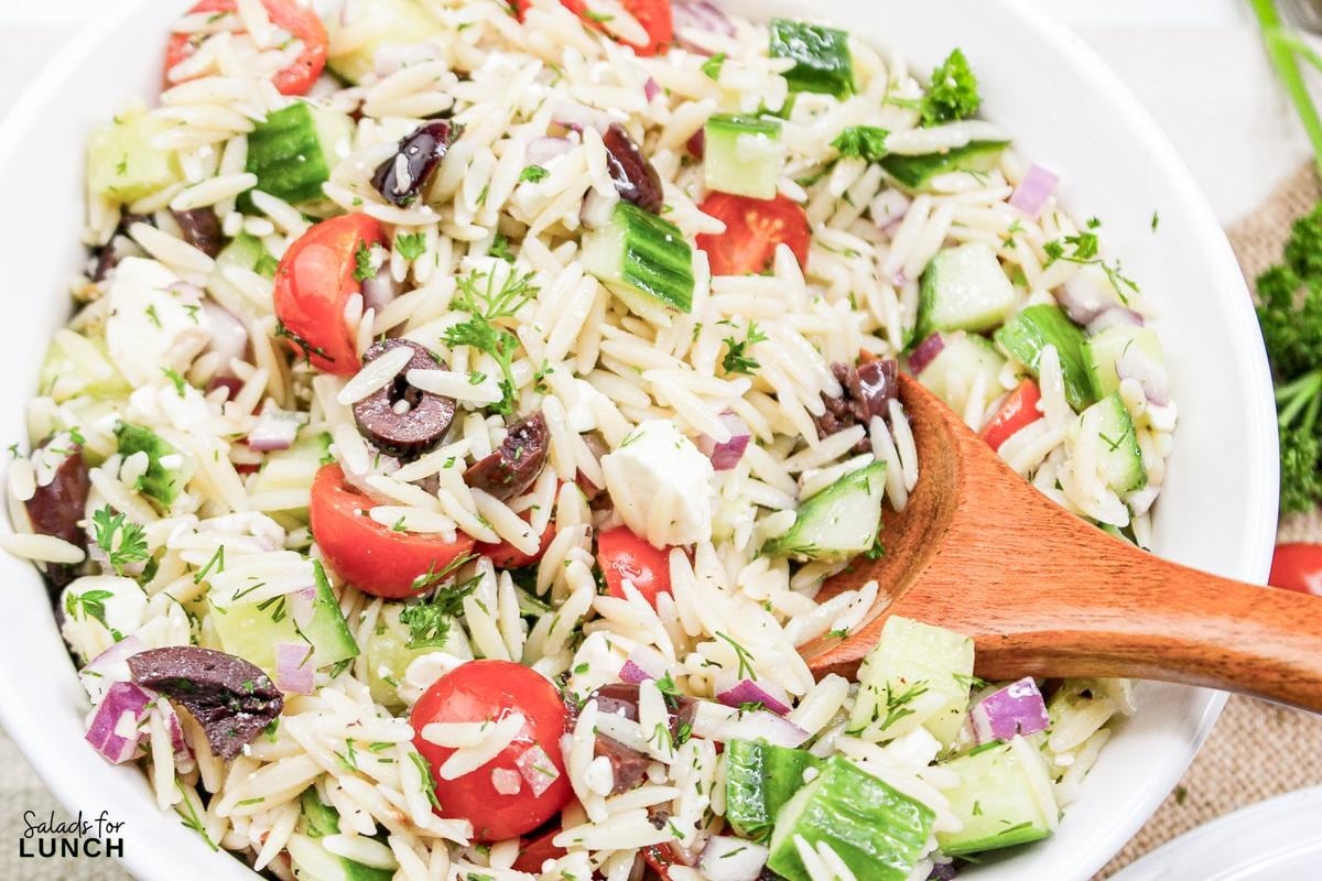 Greek Orzo Salad 19 - Are you ready to jazz up your lunchtime routine with a salad that's as delicious as it is easy to make? Say hello to the Greek Orzo Salad—a vibrant, refreshing dish that's bursting with Mediterranean flavors and perfect for any meal. Whether you're looking for a quick lunch or a light dinner, this salad is a crowd-pleaser that’s sure to satisfy. This Greek Orzo Salad comes together in just 25 minutes, making it an ideal choice for busy days when you still want to eat something healthy and delicious.