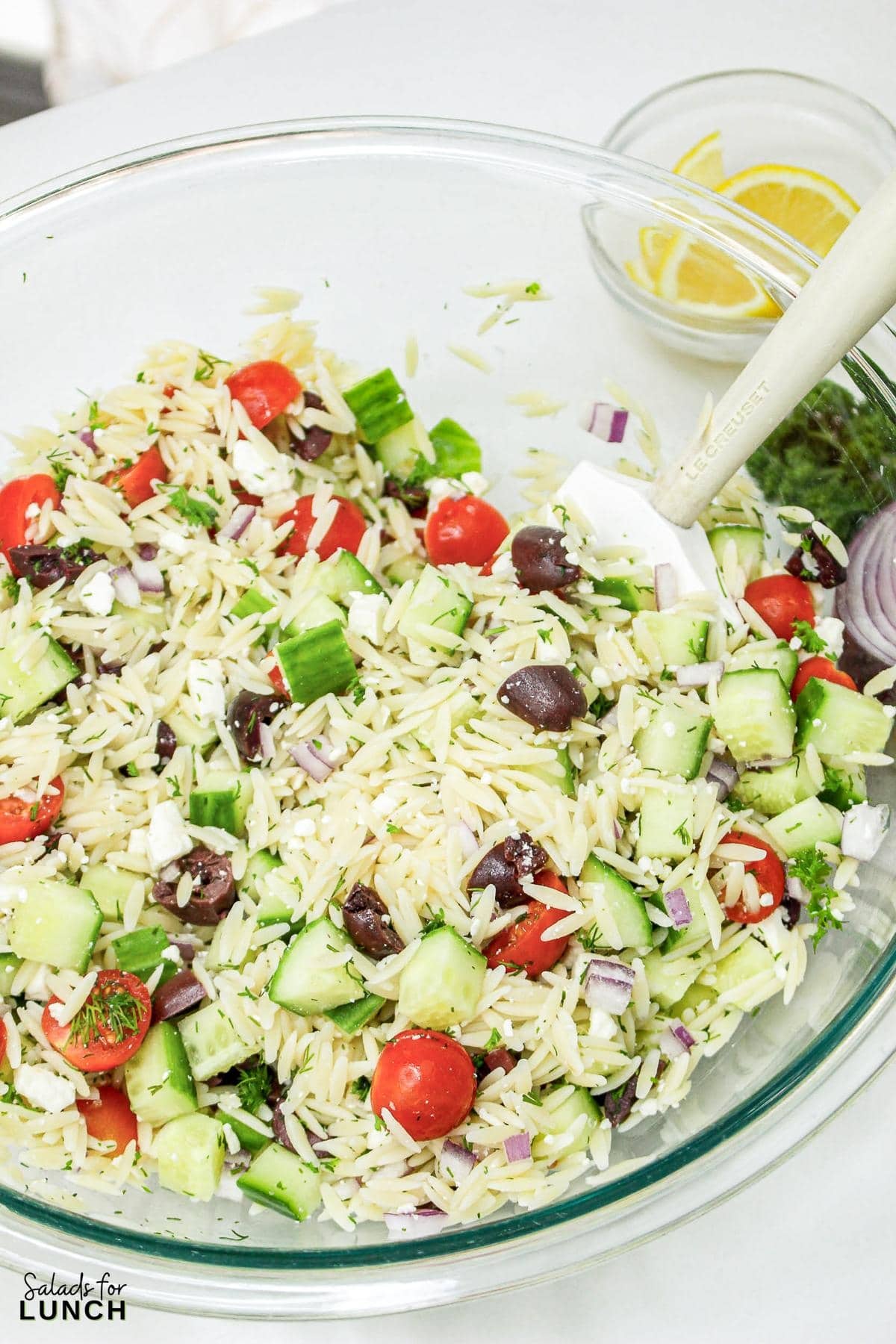 Greek Orzo Salad 4 - Are you ready to jazz up your lunchtime routine with a salad that's as delicious as it is easy to make? Say hello to the Greek Orzo Salad—a vibrant, refreshing dish that's bursting with Mediterranean flavors and perfect for any meal. Whether you're looking for a quick lunch or a light dinner, this salad is a crowd-pleaser that’s sure to satisfy. This Greek Orzo Salad comes together in just 25 minutes, making it an ideal choice for busy days when you still want to eat something healthy and delicious.