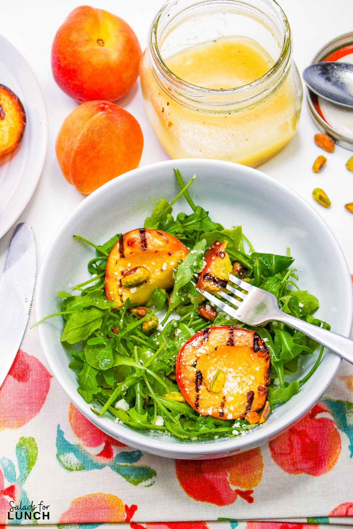 Grilled Peach Summer Salad 21 - Indulge in the flavors of the season with our Grilled Peach Summer Salad! Arugula and pistachios complement the juicy peaches, creating a refreshing and elegant dish perfect for your late summer BBQs. Get ready to savor the taste of sunshine!
