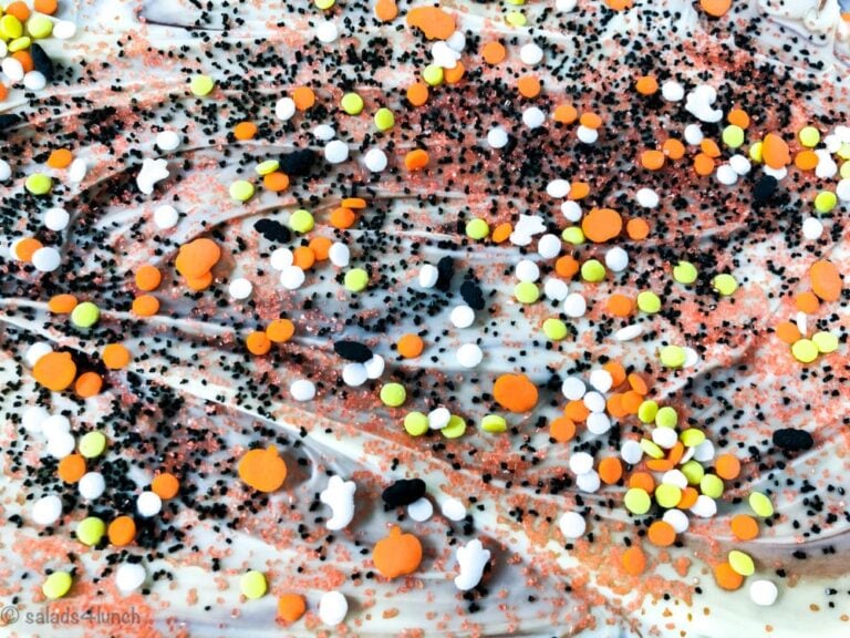 Pinterest image for Halloween Chocolate Bark - This Double Chocolate Halloween Bark recipe only takes minutes to make and is so easy that even your kids can make it. Use your imagination and make it as spooky as you want!