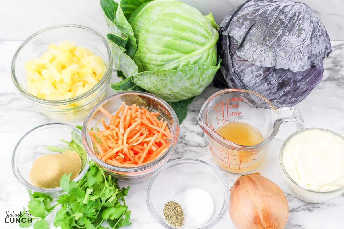 Ingredients needed to make hawaiian inspired coleslaw in clear glass pinch bowls.