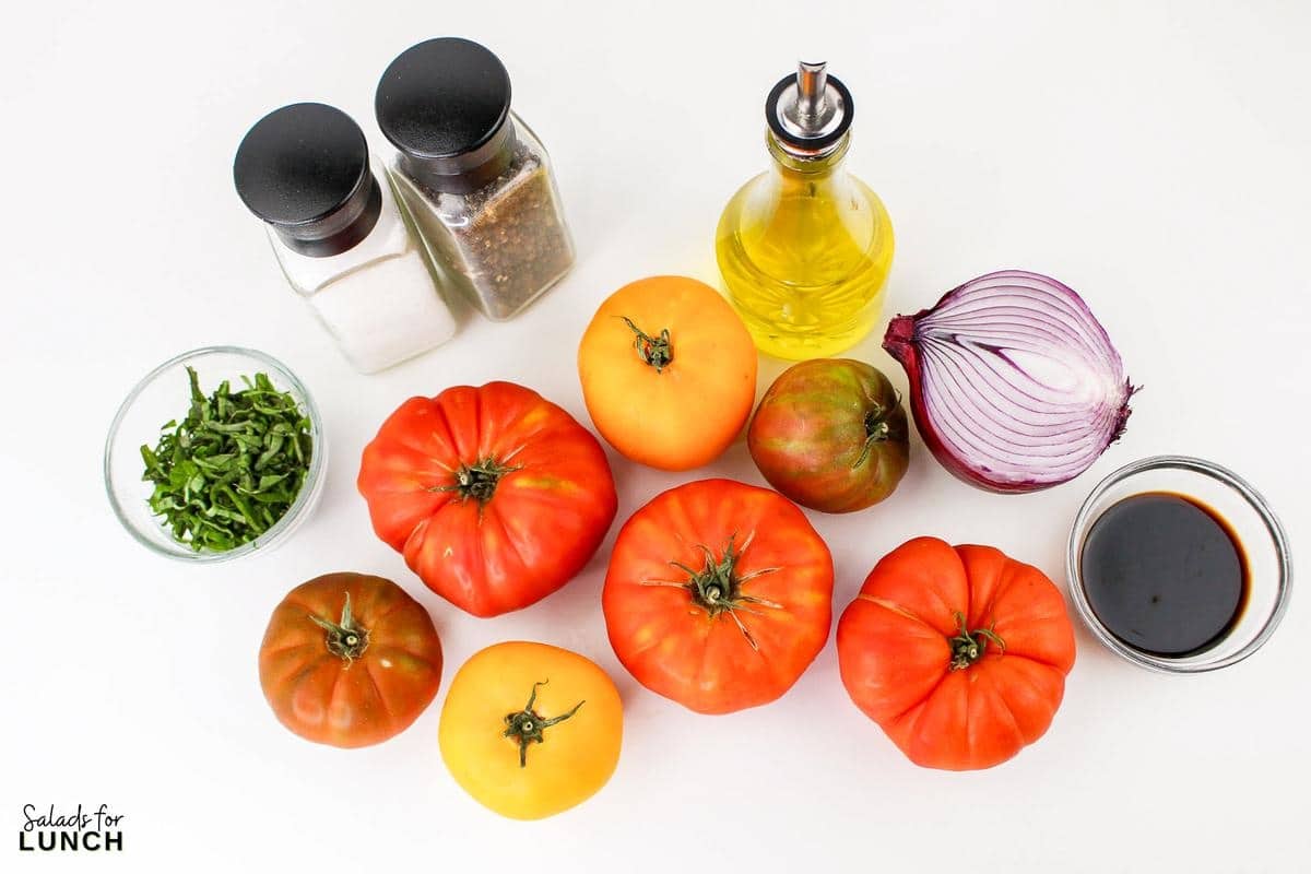 Heirloom Tomato Basil Salad Recipe 1 - This fresh and vibrant salad showcases the natural sweetness of heirloom tomatoes paired with the aromatic essence of basil. It's a perfect dish for a light lunch or as a side to complement your favorite summer meals.