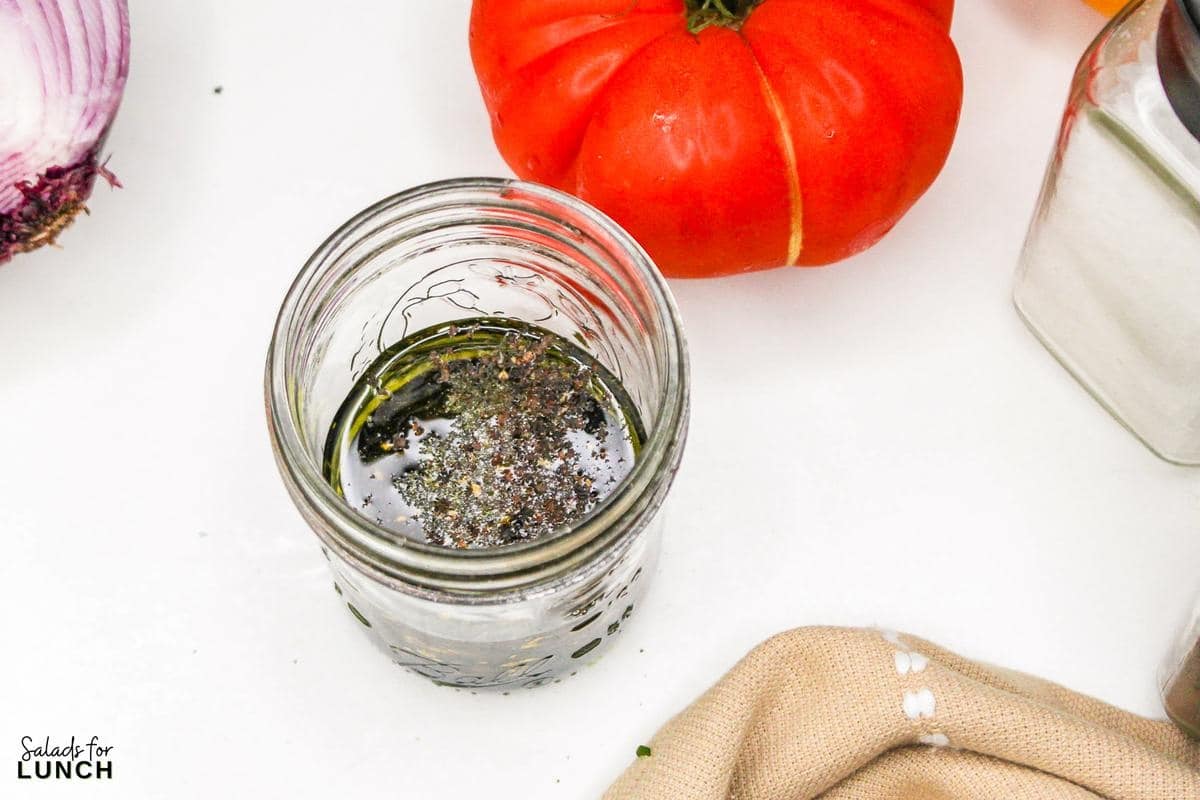 Heirloom Tomato Basil Salad Recipe 15 - This fresh and vibrant salad showcases the natural sweetness of heirloom tomatoes paired with the aromatic essence of basil. It's a perfect dish for a light lunch or as a side to complement your favorite summer meals.