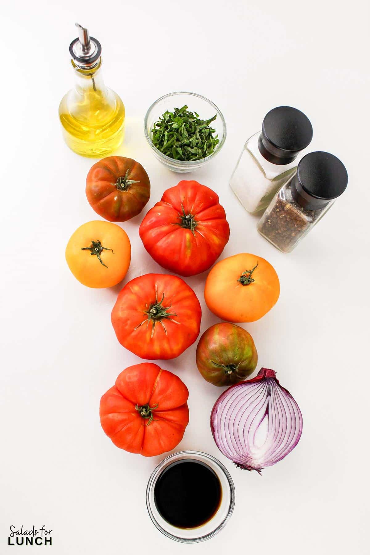 Heirloom Tomato Basil Salad Recipe 2 - This fresh and vibrant salad showcases the natural sweetness of heirloom tomatoes paired with the aromatic essence of basil. It's a perfect dish for a light lunch or as a side to complement your favorite summer meals.