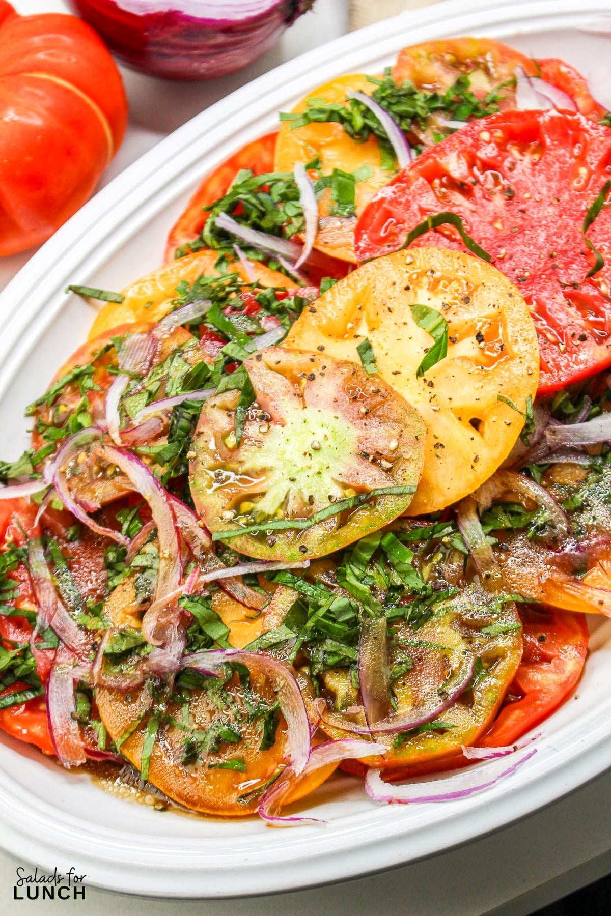 Heirloom Tomato Basil Salad Recipe 33 - This fresh and vibrant salad showcases the natural sweetness of heirloom tomatoes paired with the aromatic essence of basil. It's a perfect dish for a light lunch or as a side to complement your favorite summer meals.