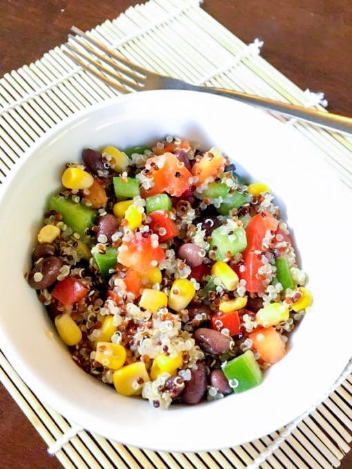 This delicious corn and black bean quinoa salad and nutritious salad can be eaten alone, as a side dish, in a wrap or in a salad with lettuce. Add chicken for some extra protein, avocado for some healthy fats or enjoy as is! #quinoasalad #saladrecipe #saladsforlunch