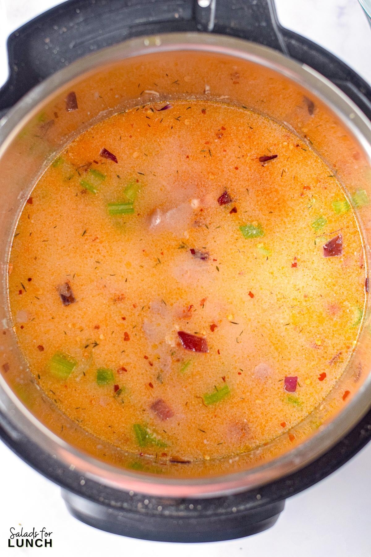 Instant Pot Buffalo Chicken Soup 7 - Get ready to warm up your taste buds with this Instant Pot Creamy Buffalo Chicken Soup recipe! Packed with tender chunks of chicken, a creamy base with a kick of hot buffalo sauce, and a medley of veggies, it's the perfect comfort food for any season. With just a few simple ingredients, your Instant Pot will do all the work, making this hearty soup a quick and delicious dinner idea.