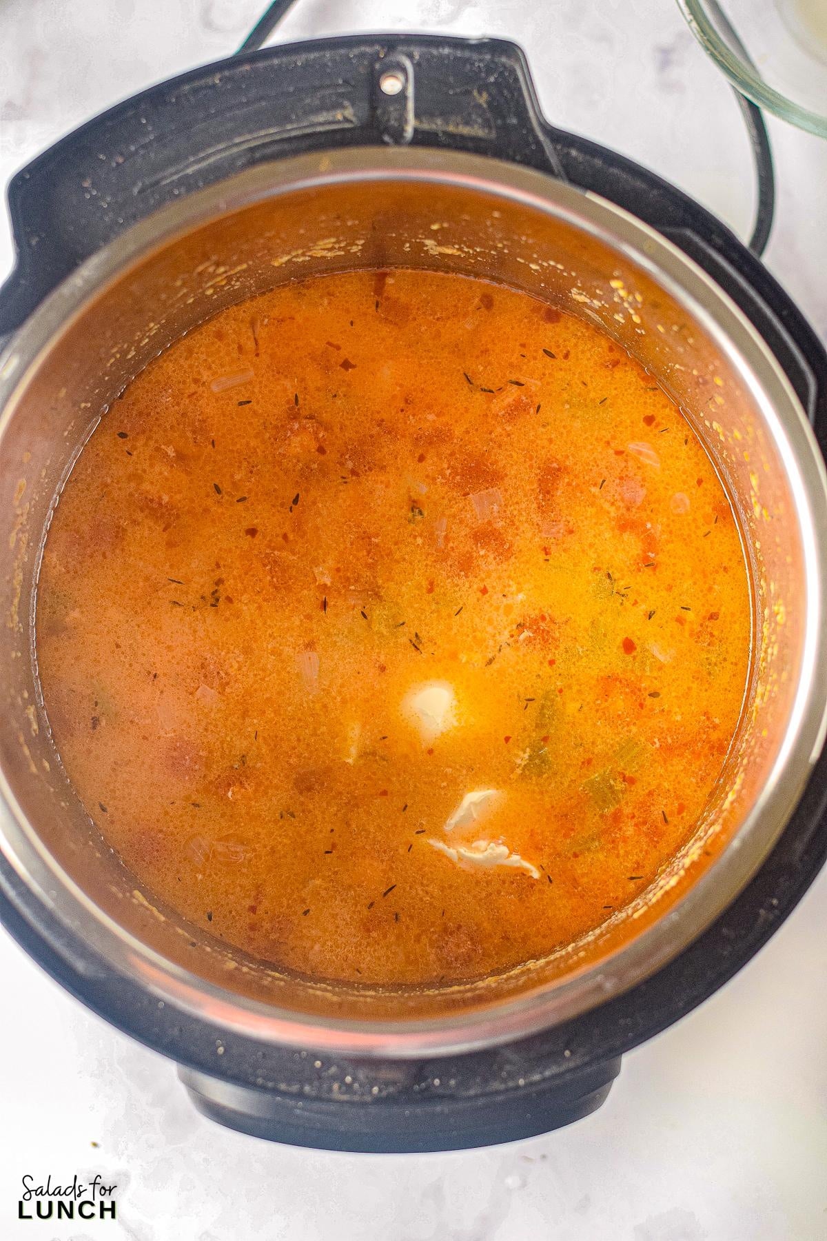 Instant Pot Buffalo Chicken Soup 8 - Get ready to warm up your taste buds with this Instant Pot Creamy Buffalo Chicken Soup recipe! Packed with tender chunks of chicken, a creamy base with a kick of hot buffalo sauce, and a medley of veggies, it's the perfect comfort food for any season. With just a few simple ingredients, your Instant Pot will do all the work, making this hearty soup a quick and delicious dinner idea.