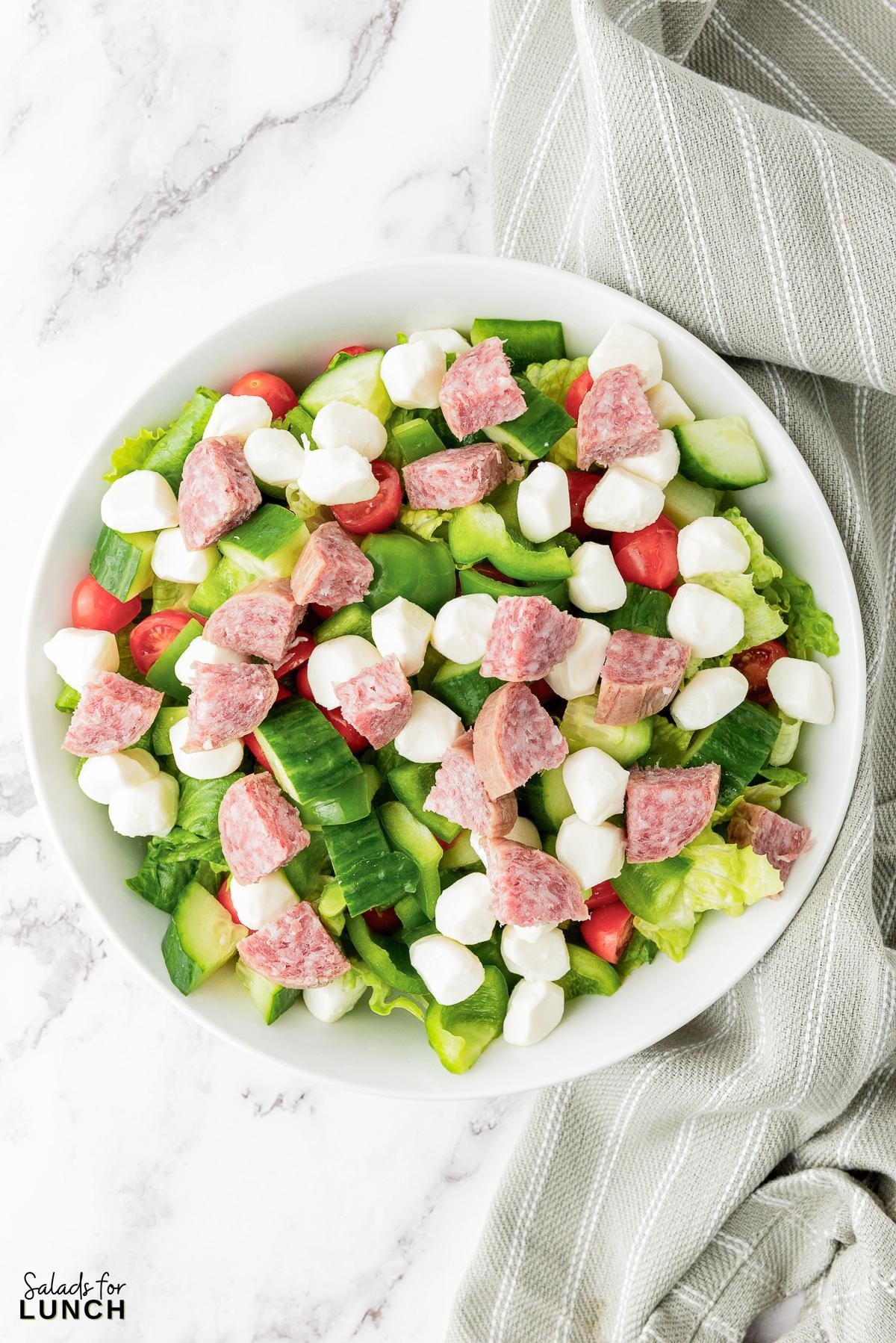 Italian Chopped Salad Recipe 18 - This hearty Italian Chopped Salad with Zesty Dressing that is the perfect mix of healthy and satisfying. Whether you’re craving a healthy dinner option or a dish that’s quick to prepare, this salad has you covered. Get ready to enjoy a meal that’s as nutritious as it is delicious!