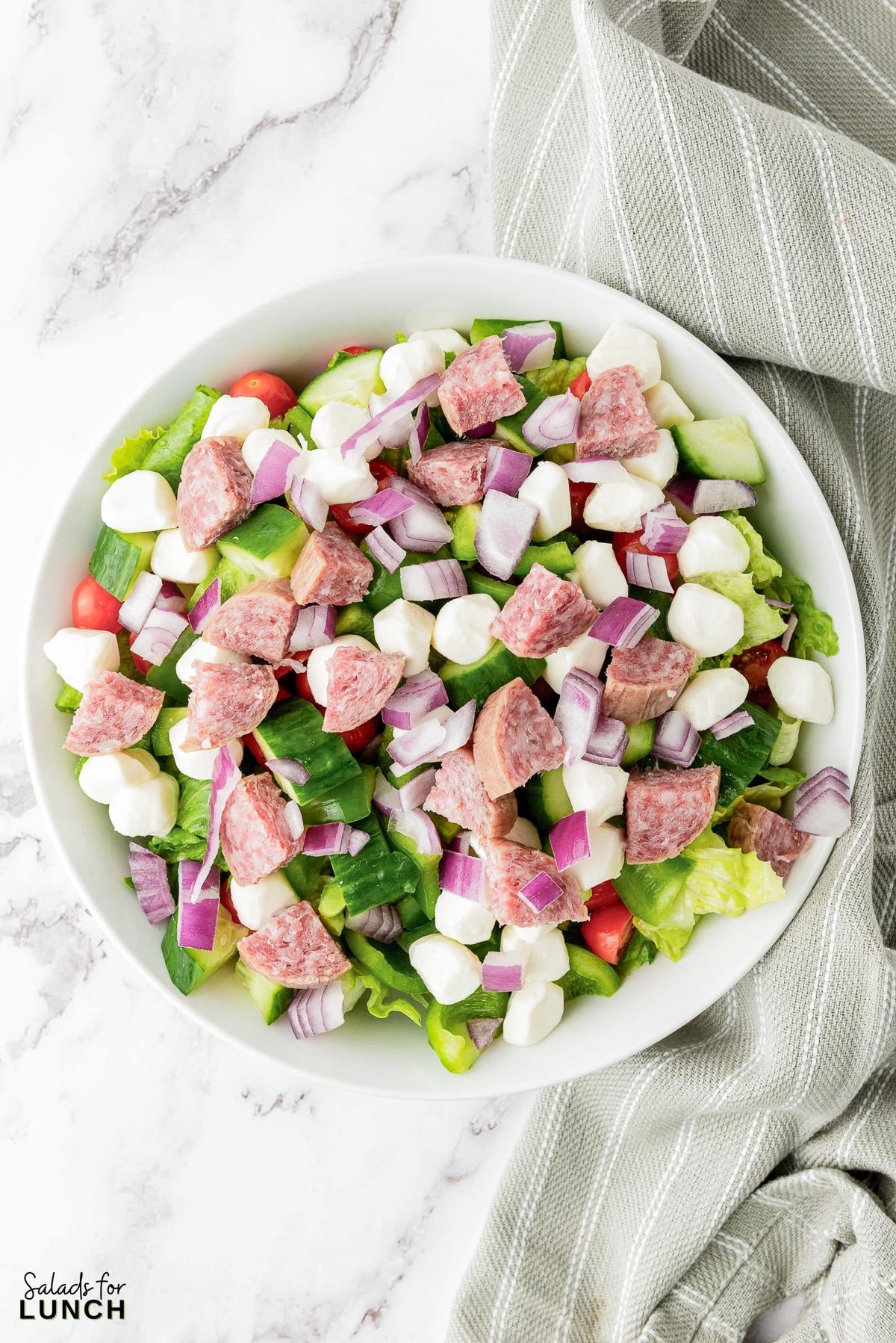 Italian Chopped Salad Recipe 19 - This hearty Italian Chopped Salad with Zesty Dressing that is the perfect mix of healthy and satisfying. Whether you’re craving a healthy dinner option or a dish that’s quick to prepare, this salad has you covered. Get ready to enjoy a meal that’s as nutritious as it is delicious!