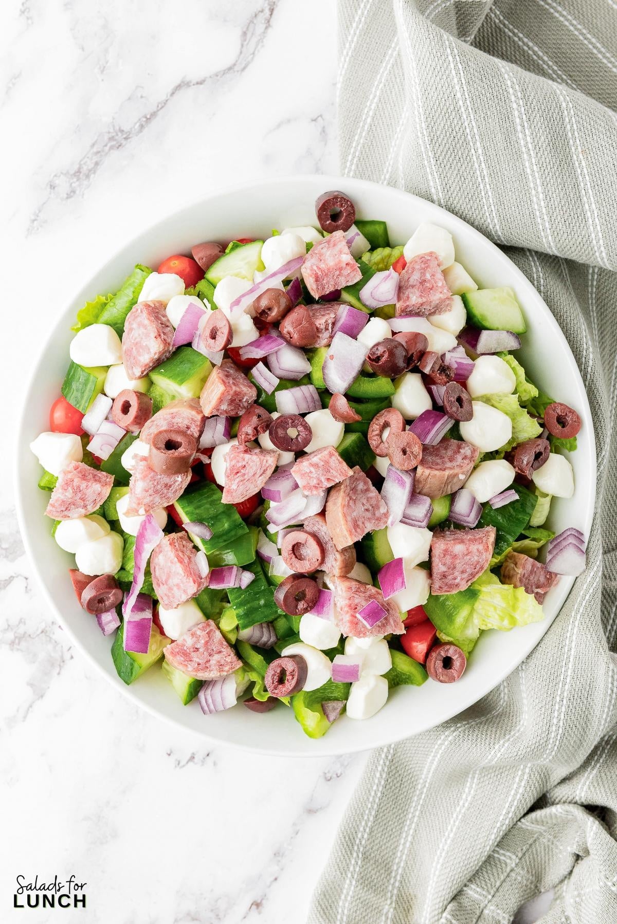 Italian Chopped Salad Recipe 20 - This hearty Italian Chopped Salad with Zesty Dressing that is the perfect mix of healthy and satisfying. Whether you’re craving a healthy dinner option or a dish that’s quick to prepare, this salad has you covered. Get ready to enjoy a meal that’s as nutritious as it is delicious!