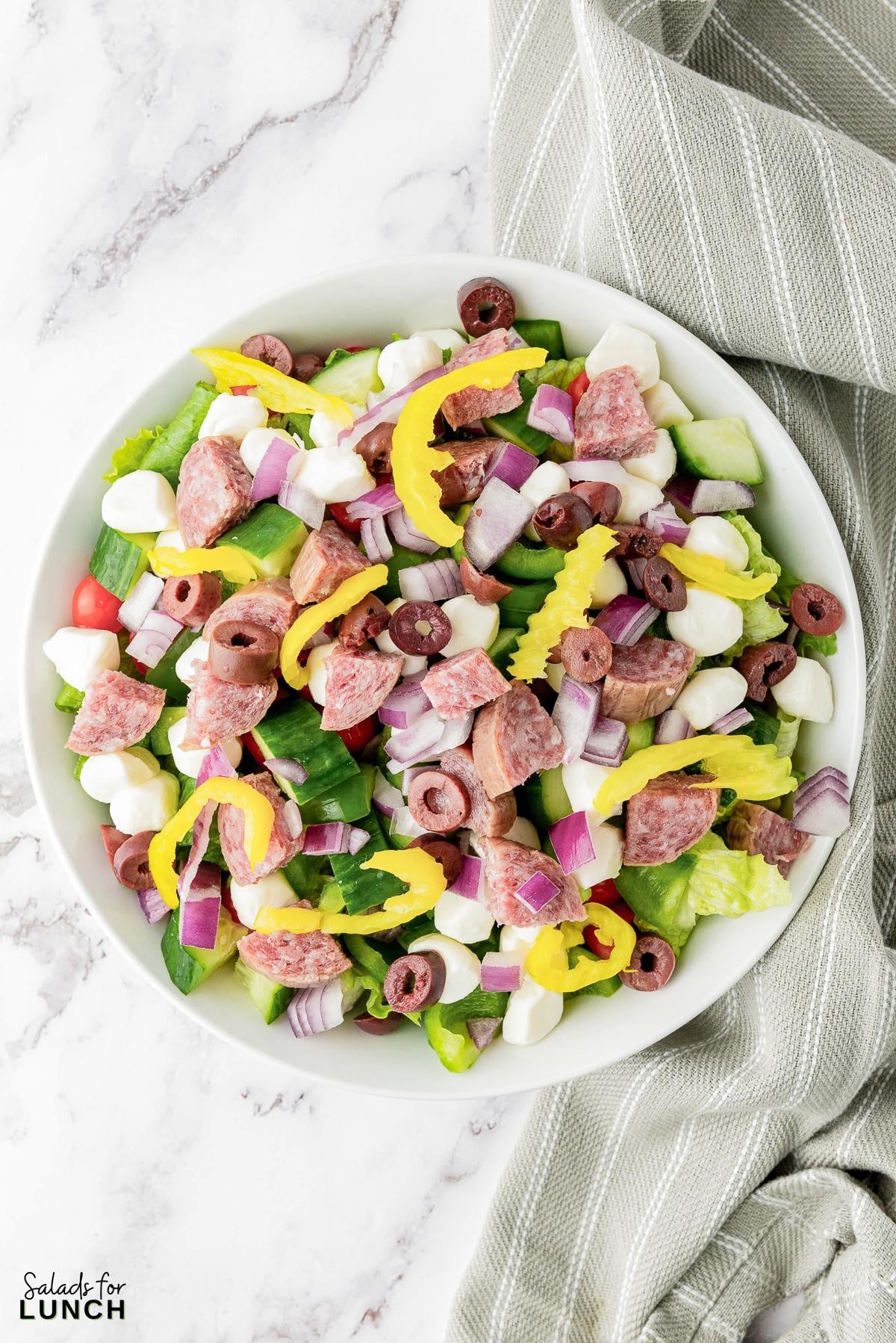 Italian Chopped Salad Recipe 21 - This hearty Italian Chopped Salad with Zesty Dressing that is the perfect mix of healthy and satisfying. Whether you’re craving a healthy dinner option or a dish that’s quick to prepare, this salad has you covered. Get ready to enjoy a meal that’s as nutritious as it is delicious!