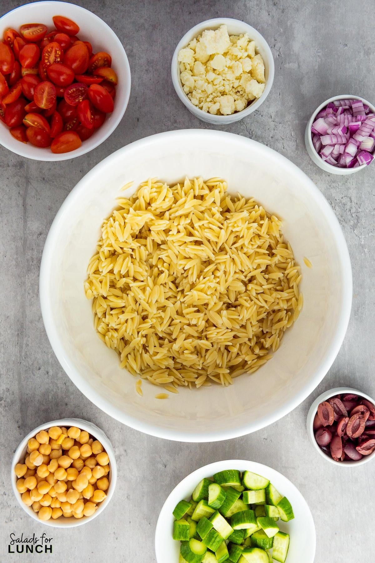 Mediterranean Orzo Salad Recipe 2 - You're going to love this Mediterranean Orzo Salad, a delightful blend of orzo pasta, cherry tomatoes, Persian cucumbers, and kalamata olives
