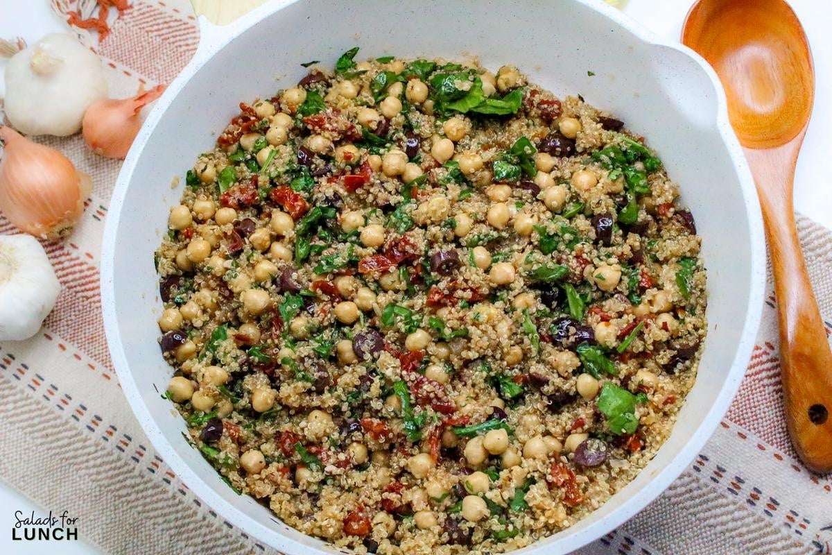 Mediterranean Quinoa Salad Recipe 14 - This Mediterranean Quinoa Bowl with Chickpeas is a tasty and healthy salad that is hearty enough to have as a meal. Enjoy every bite of this fun, flavorful dish at your next lunch break!