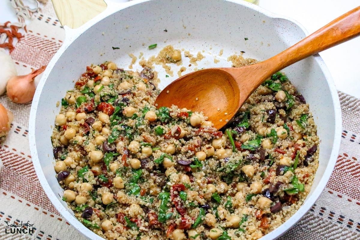 Mediterranean Quinoa Salad Recipe 18 - This Mediterranean Quinoa Bowl with Chickpeas is a tasty and healthy salad that is hearty enough to have as a meal. Enjoy every bite of this fun, flavorful dish at your next lunch break!