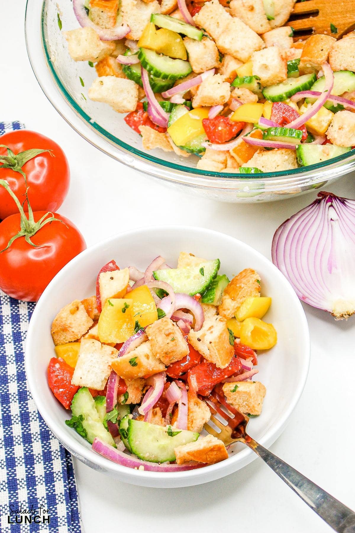 Panzanella Salad 24 - This Classic Italian Panzanella Salad (aka Tuscan Bread Salad) is a refreshing summer salad made with juicy tomatoes, crusty bread, and a simple vinaigrette. This is a great salad to bring to a summer BBQ.