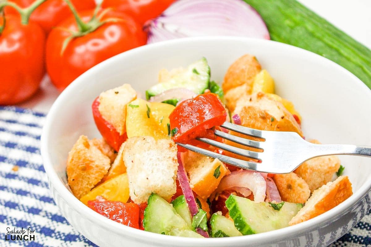 Panzanella Salad 30 - This Classic Italian Panzanella Salad (aka Tuscan Bread Salad) is a refreshing summer salad made with juicy tomatoes, crusty bread, and a simple vinaigrette. This is a great salad to bring to a summer BBQ.