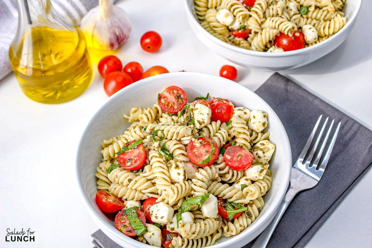 Pesto Caprese Pasta Salad 10 - This pasta salad is loaded with your favorite pasta noodles, fresh tomatoes and mozzarella and tossed in the best tasty pesto! It's such an easy dish and perfect for anytime of the year!