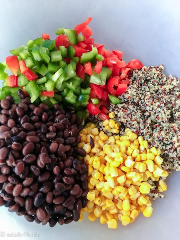 Quinoa Black Bean Salad 1 - This delicious and healthy corn and black bean quinoa salad is the perfect summer salad! It can be eaten alone, as a side dish, or in a wrap. Add chicken for some extra protein, avocado for some healthy fats or enjoy as is!