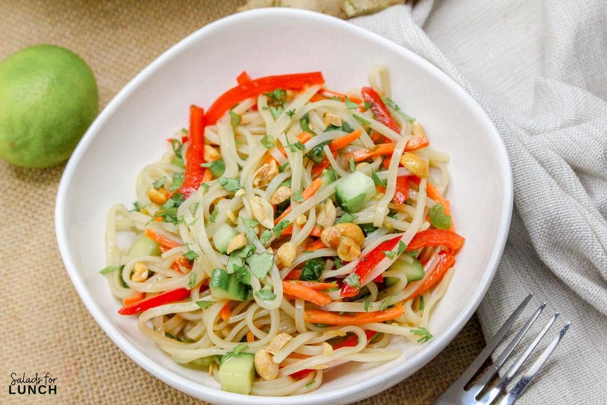 Rice Noodle Salad Recipe 16 - This refreshing salad features tender rice noodles tossed with crisp vegetables and a tangy sesame-lime dressing. It's perfect as a light main course or a flavorful side dish.