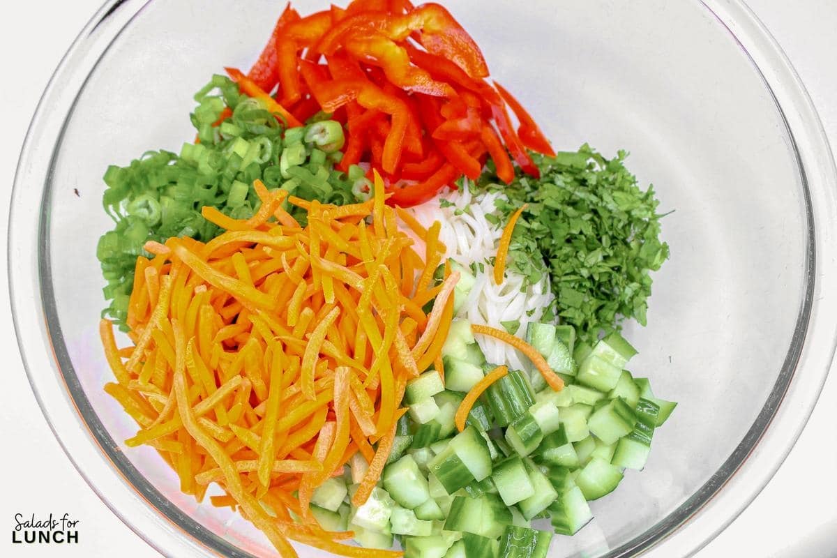 Rice Noodle Salad Recipe 7 - This refreshing salad features tender rice noodles tossed with crisp vegetables and a tangy sesame-lime dressing. It's perfect as a light main course or a flavorful side dish.